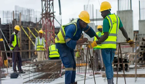 Site engineers reviewing construction progress, representing the development timeline of a residential project